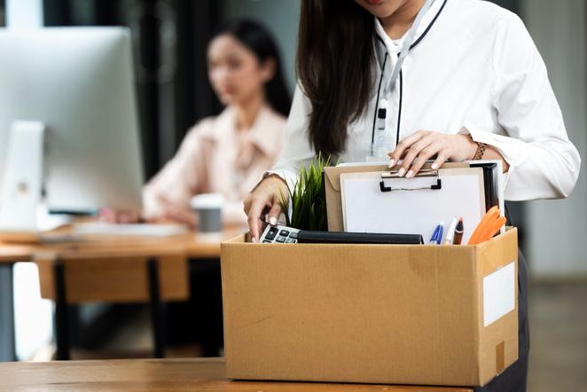Resign From Job Or Fired Employee Moving Out Of Office, Frustrated Fired Asian Employee Woman Packing Belongings In Cardboard Box