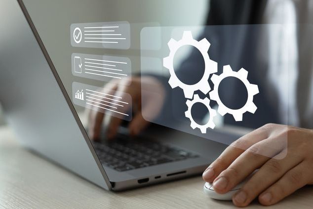 Automated industrial technology with digital transformation.Engineer setting up automated software.Business process optimisation.Robotic process automation or RPA