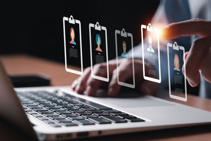 Entrepreneur using electronic devices for store customer data to gain customer insight in order to create marketing campaign that can help to increase sale and identify potential customer.