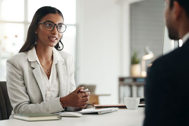 Interview, human resources and meeting with business people, conversation and hiring with b2b and recruitment. Woman HR manager, man and communication, networking and onboarding with collaboration