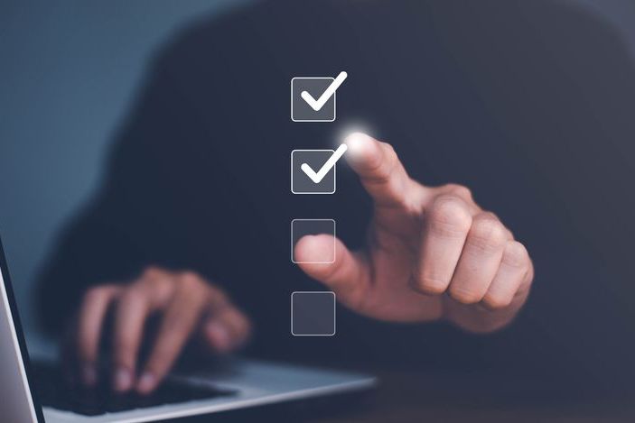 Businessman use finger to tick correct sign mark in checkbox for quality document control checklist and business approve project concept.