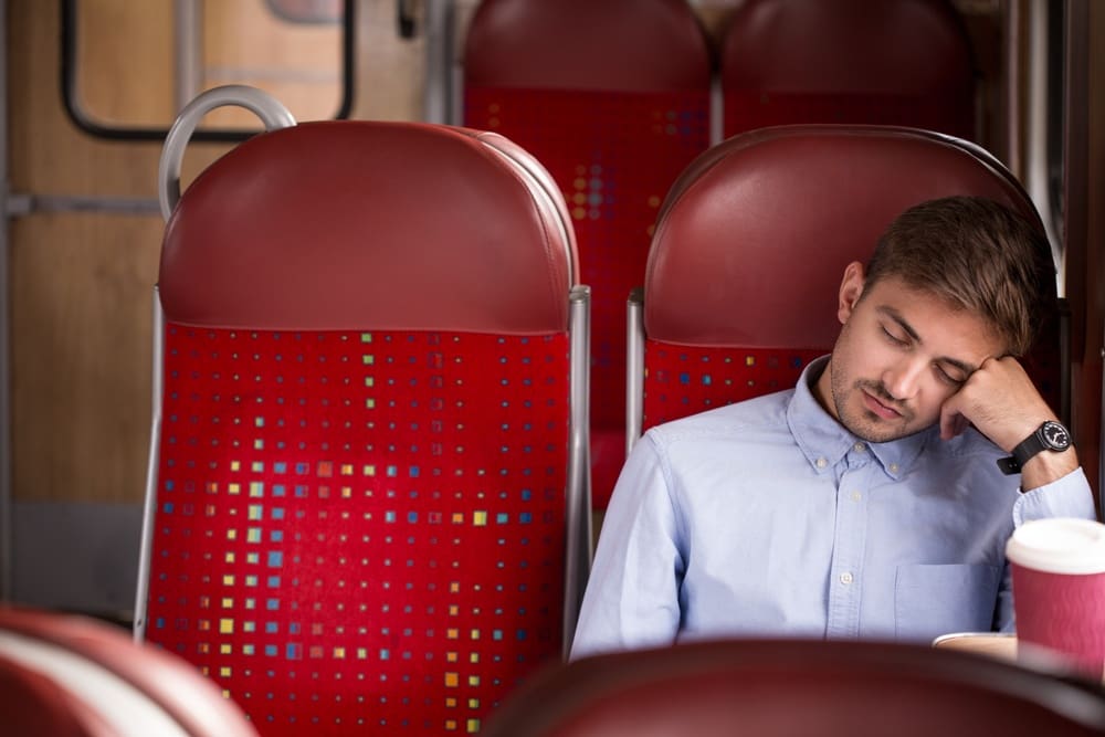 Photo of tired commuter going home after work