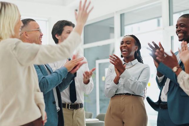 Happy, business people and applause with congratulations for winning, promotion or success at office. Group of employees clapping with smile for collaboration, teamwork or bonus together at workplace